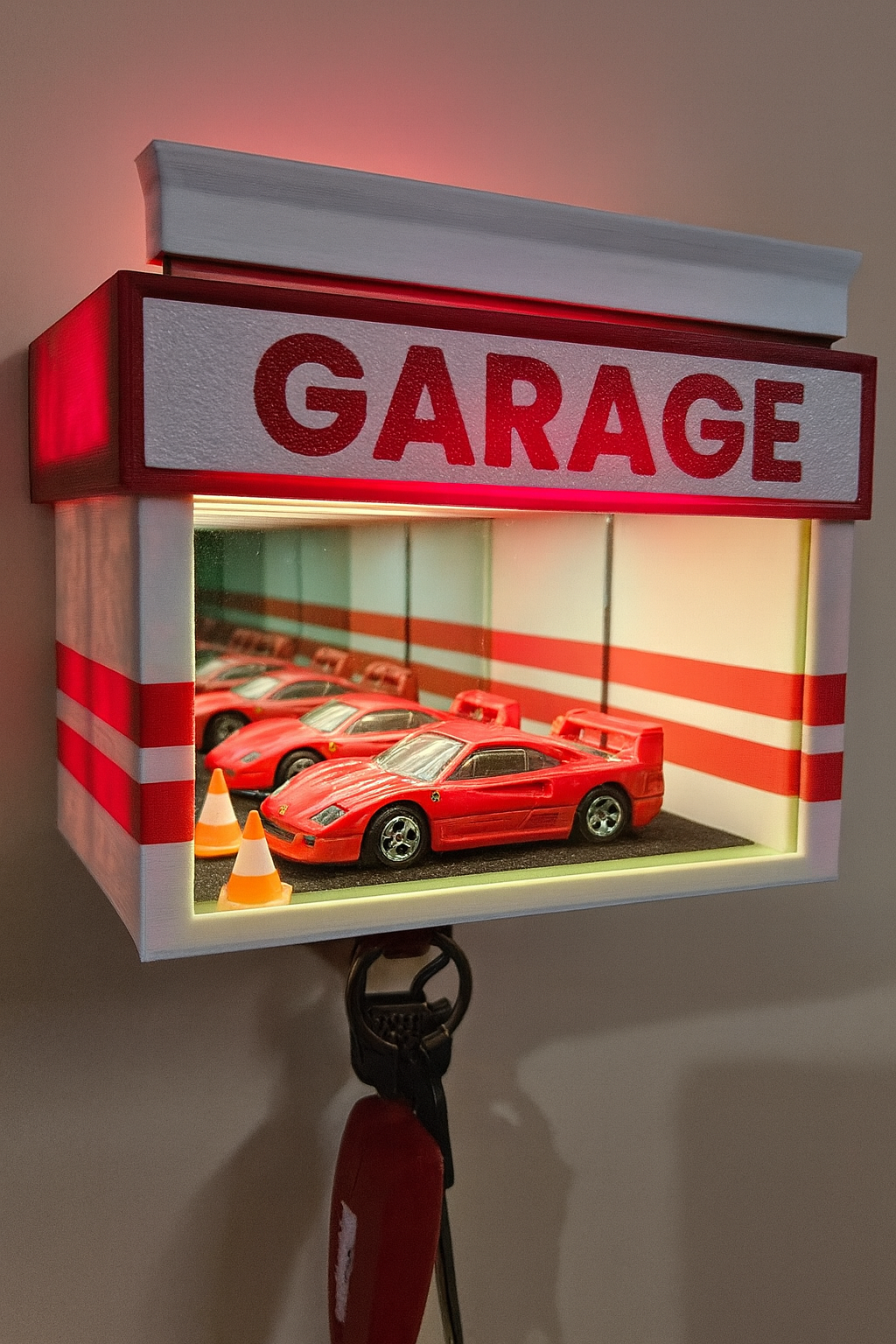 Decorative wall hook with 'GARAGE' sign and miniature cars inside