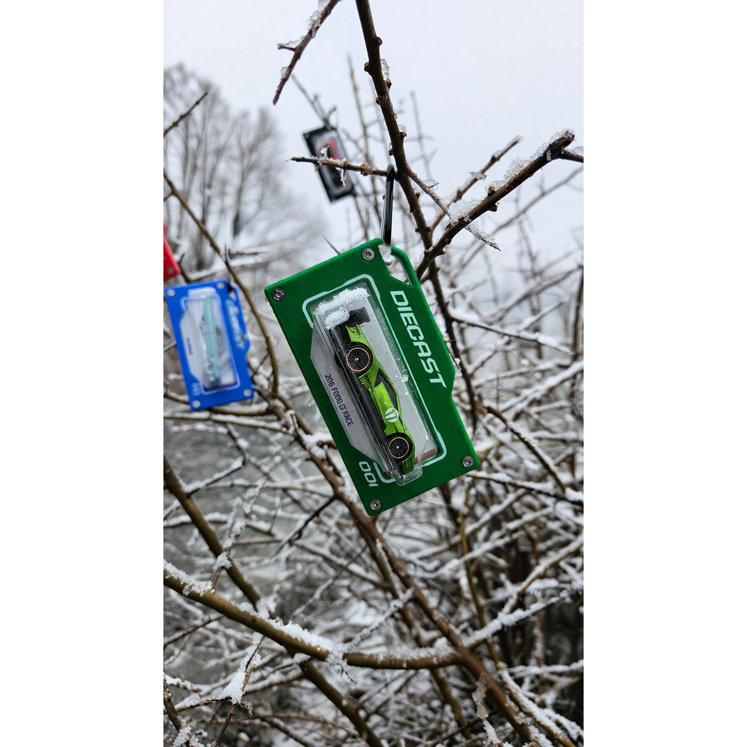 diecast green bag tag in snow